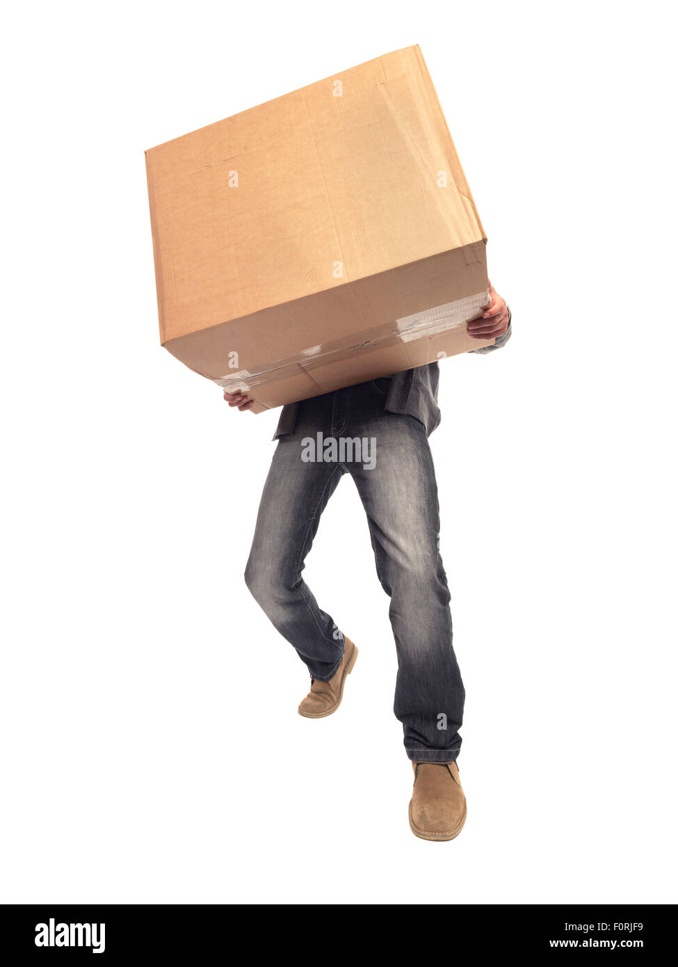shot of man carrying large box and struggling with the weight of it while moving house Stock Photo