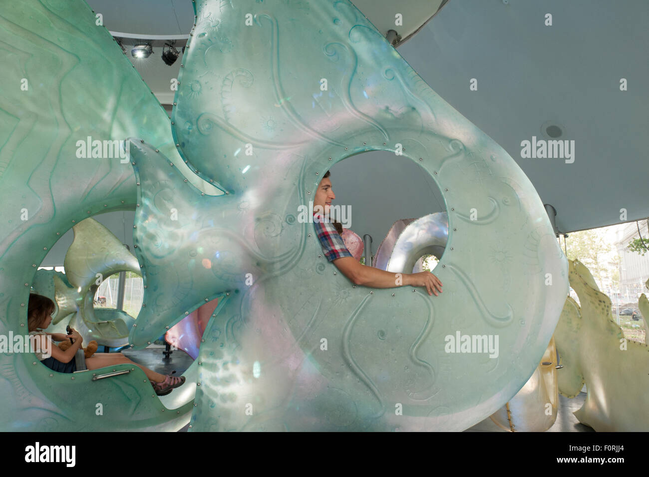 At the SeaGlass carousel in Manhattan's Battery Park, riders sit inside