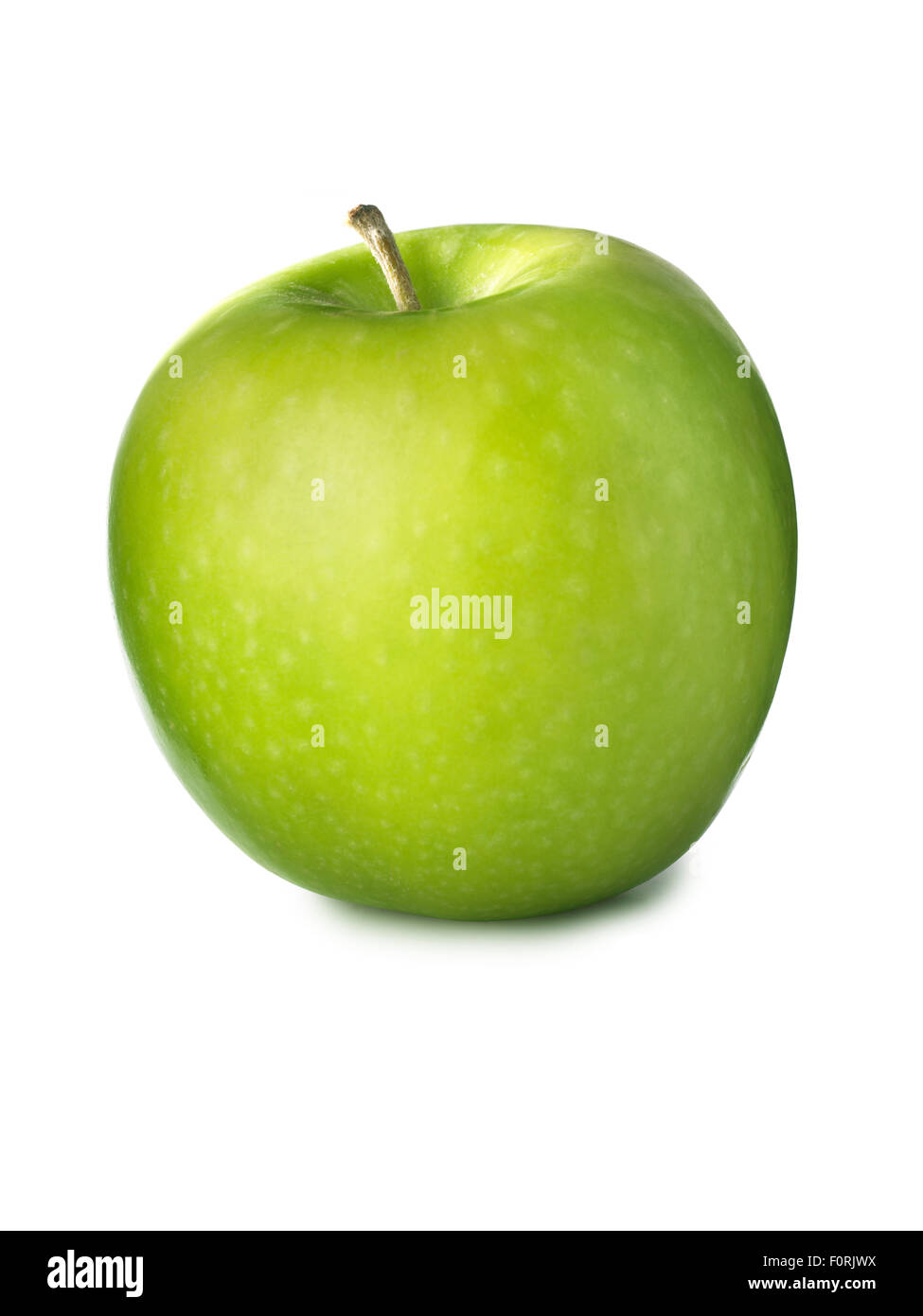 simple shot of green, granny smith apple isolated on a white background with its original shadow. Stock Photo