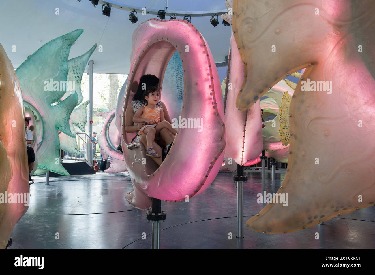 At the SeaGlass carousel in Manhattan's Battery Park, riders sit inside