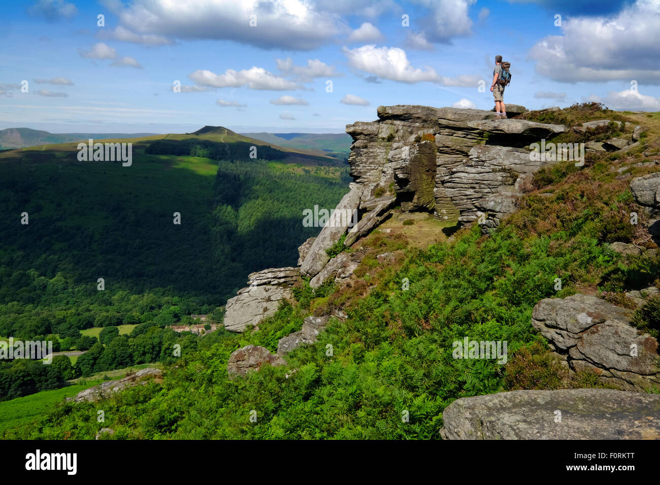 A walker on  Bamford Edge in the Derbyshire Peak District Stock Photo