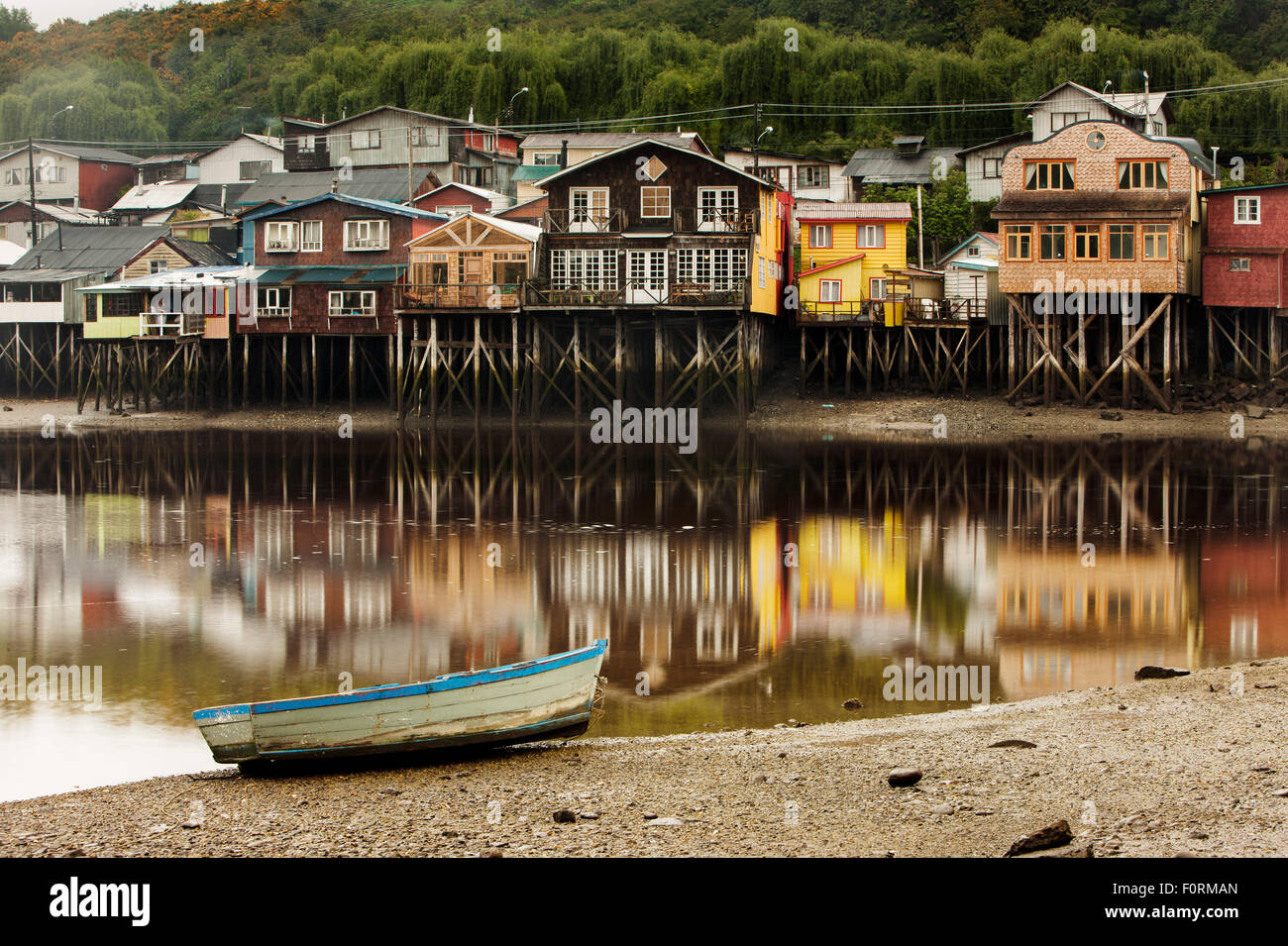 Palafito houses (stilts) in the tidal bay at Chiloe. Patagonia, Chile. Stock Photo