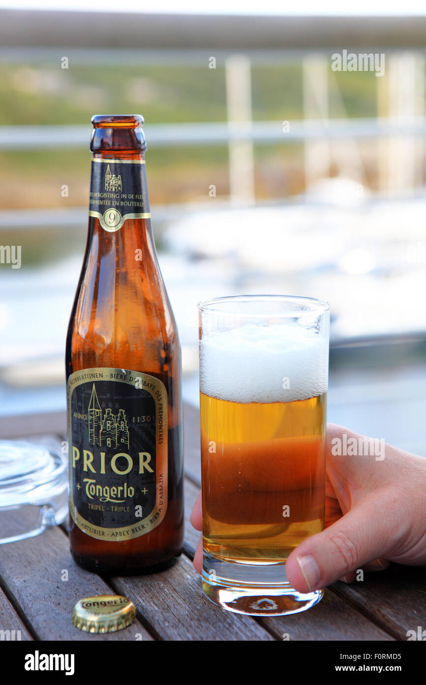 Bottle and glass of Prior Tongerlo Belgium beer. Stock Photo