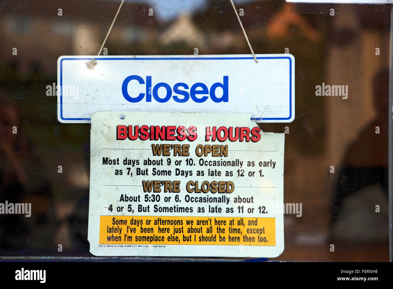 Amusing business hours notice hanging on a shop door in the west coast