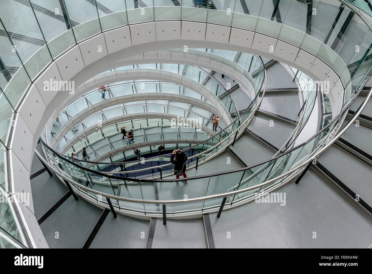 The interior spiral staircase at London City Hall which is the headquarters of the Greater London Authority (GLA) , London, UK Stock Photo