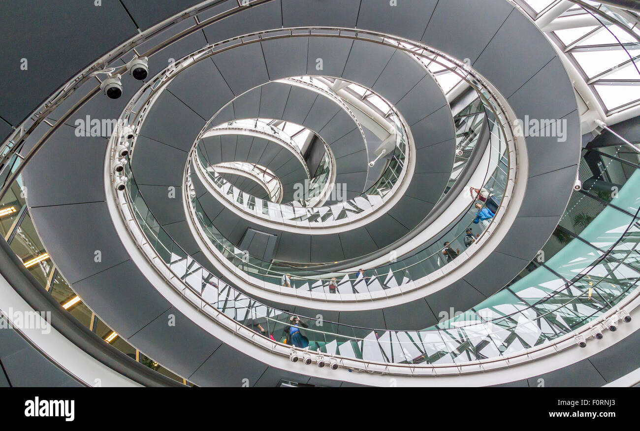 The interior spiral staircase at London City Hall which is the headquarters of the Greater London Authority (GLA) , London, UK Stock Photo