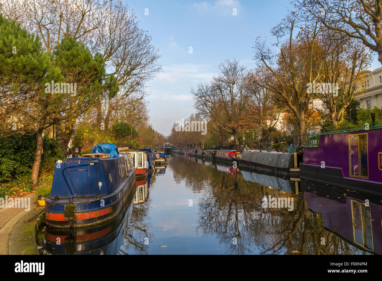 Narrowboats moored up on The Regents Canal ,on a winters morning along a section of The Grand Union Canal which runs through London Stock Photo