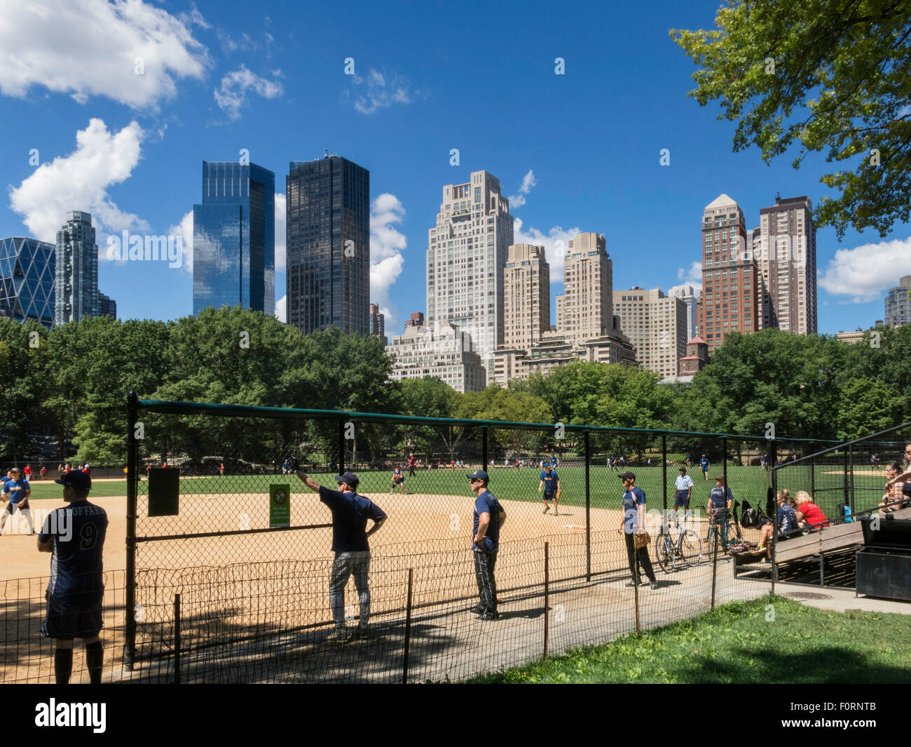 Softball Game at Heckscher Ballfields, Central Park, NYC Stock Photo