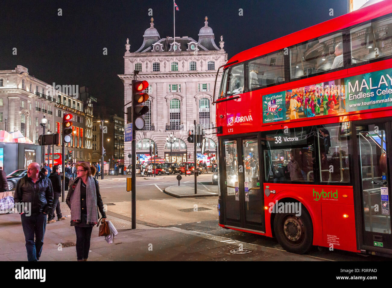 No 38 London Bus Approaching Piccadilly Circus, at Night , London Stock Photo