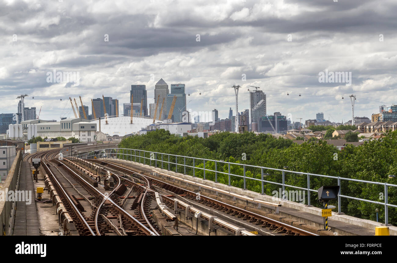 Canary Wharf From Pontoon Dock DLR Station with railway tracks,of the Docklands Light railway , London, UK Stock Photo