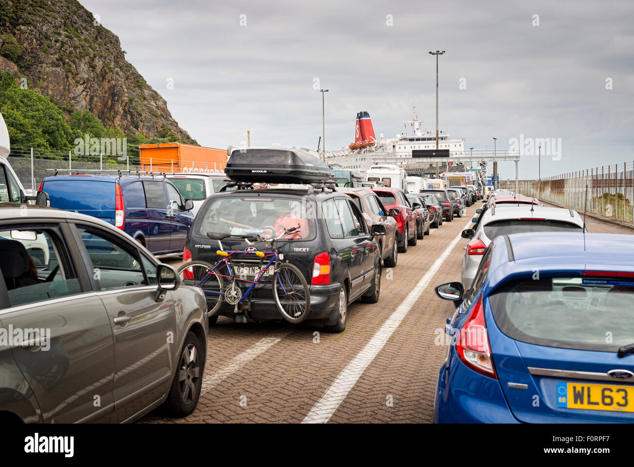 Cars waiting to board the MS Stena Europe ferry at Fishguard heading to Rosslare Stock Photo
