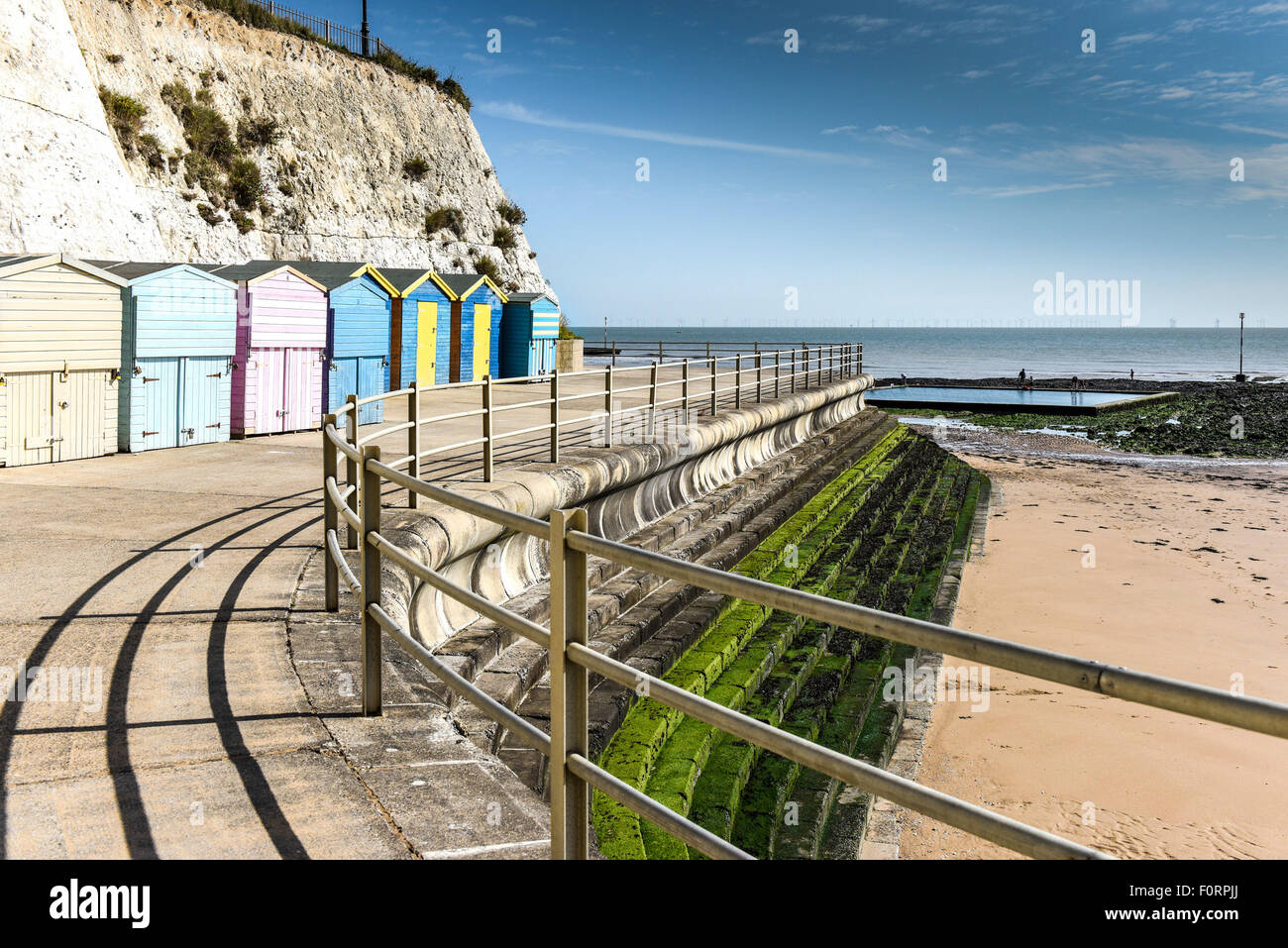 Beach huts on the promenade at Louisa Bay in Broadstairs, Kent Stock