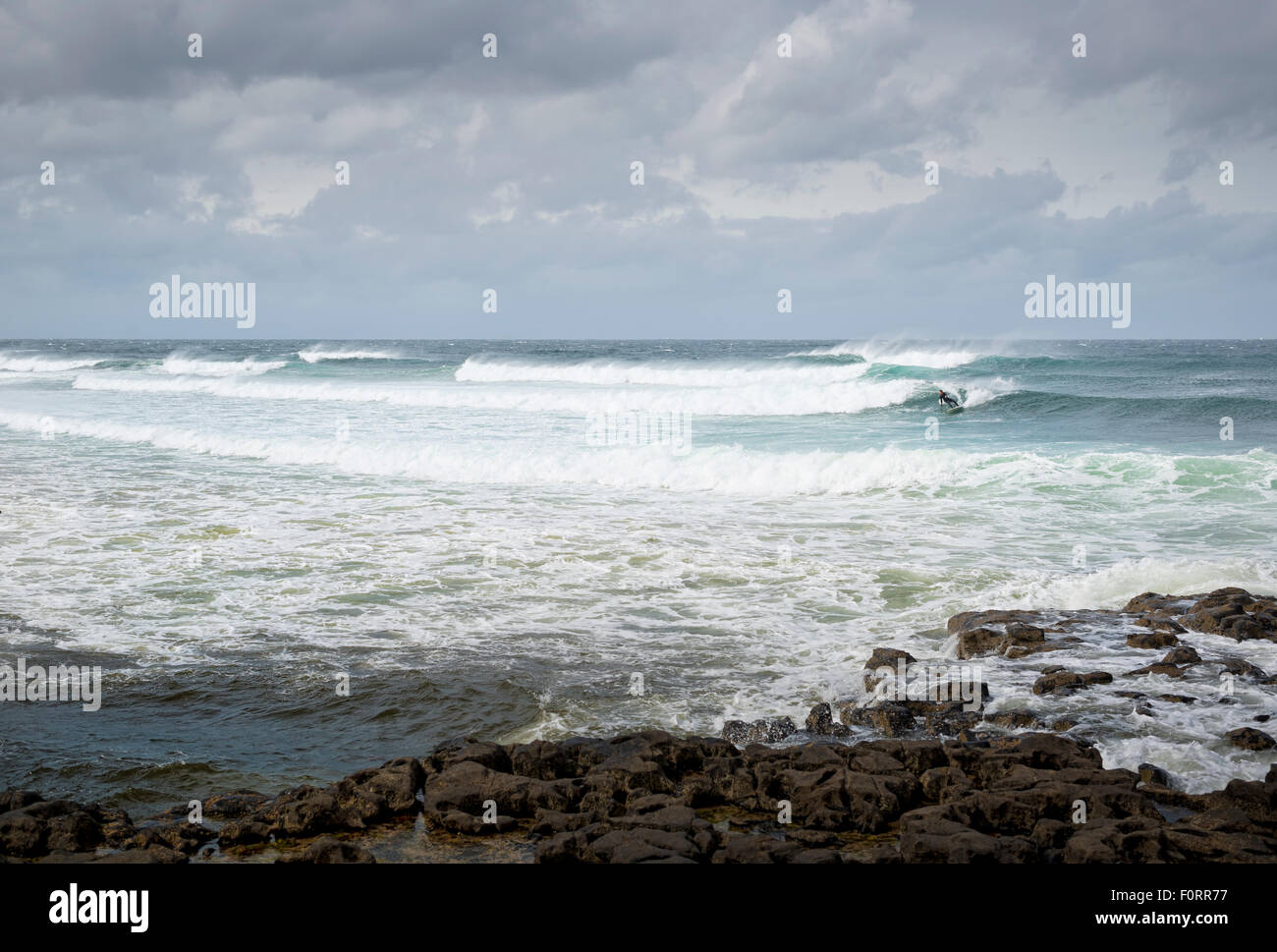 Suffer riding a wave in the Atlantic of the west coast of Ireland. Easky Co. Sligo Stock Photo