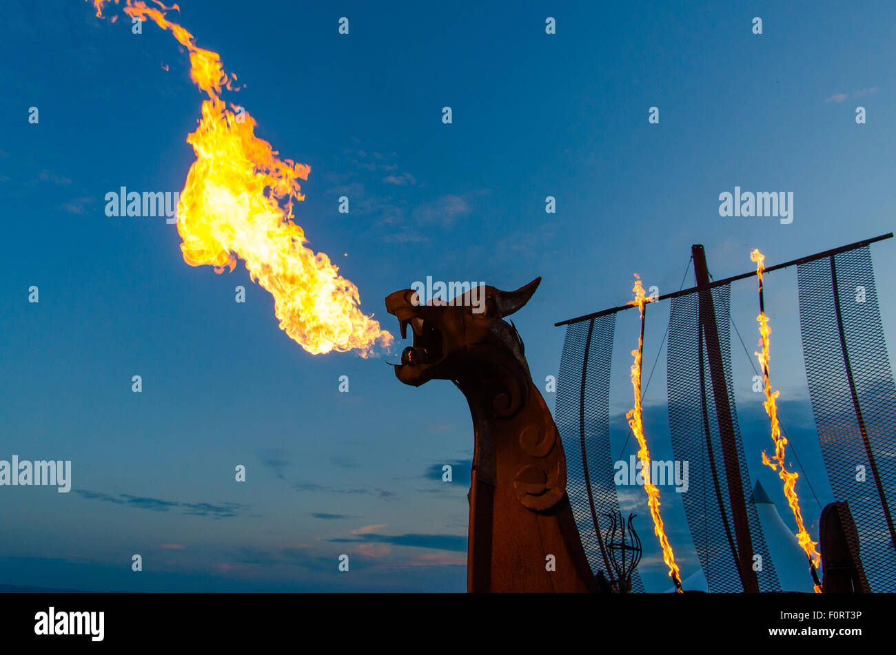A fiery image of a dragon viking boat with flames coming from it's mouth. Taken at Barry Island's Isle of Fire Stock Photo