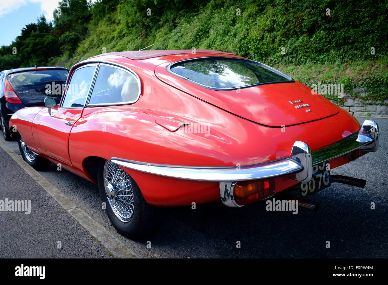 A fully restored stunning Jaguar E type classic car that was parked up on the street Stock Photo