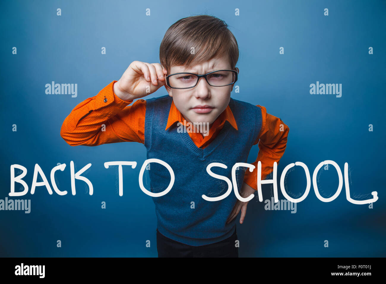 European-looking boy of ten years in glasses, anger, resentment Stock Photo