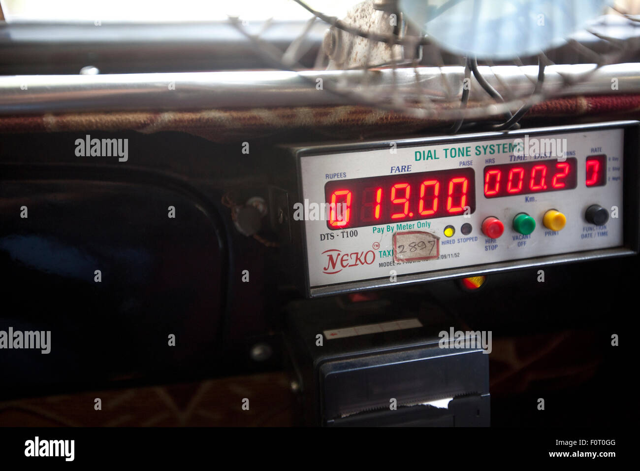 Dashboard with a Meter reading device in a local Mumbai Taxi. Stock Photo