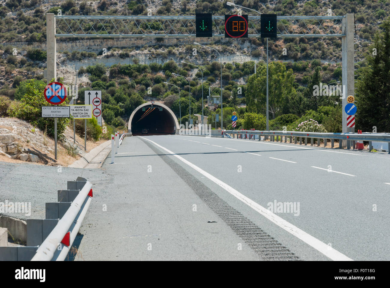 Road tunnel and traffic signs in Cyprus highway Stock Photo Alamy