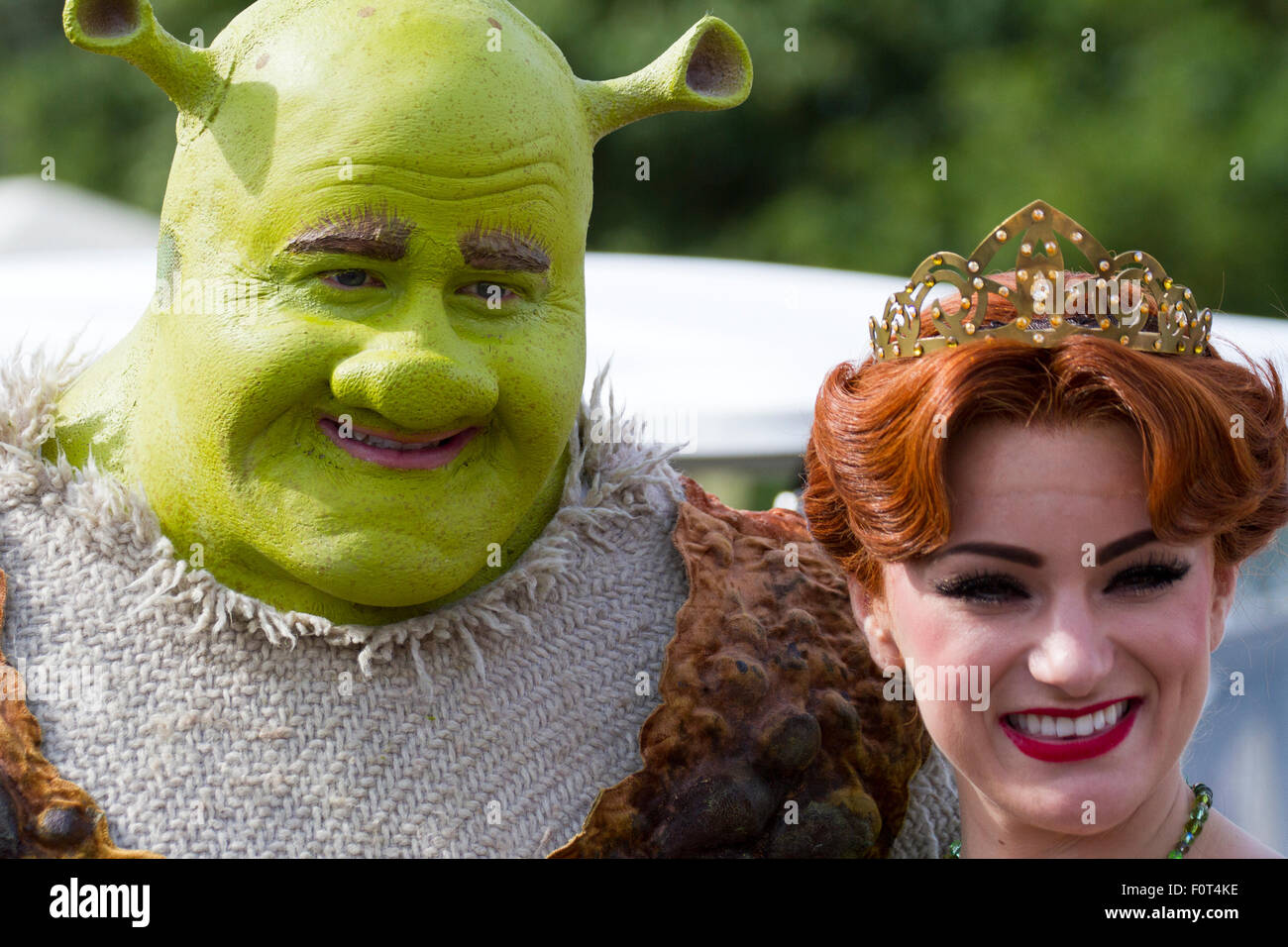Shrek & Fiona actors entertaining the crowds at Southport Flower Show.  Britain’s biggest independent flower show, celebrates with a carnival-like celebration of themed events, entertainment, food and floral marquees will all be inspired by fil star culture and design. Stock Photo