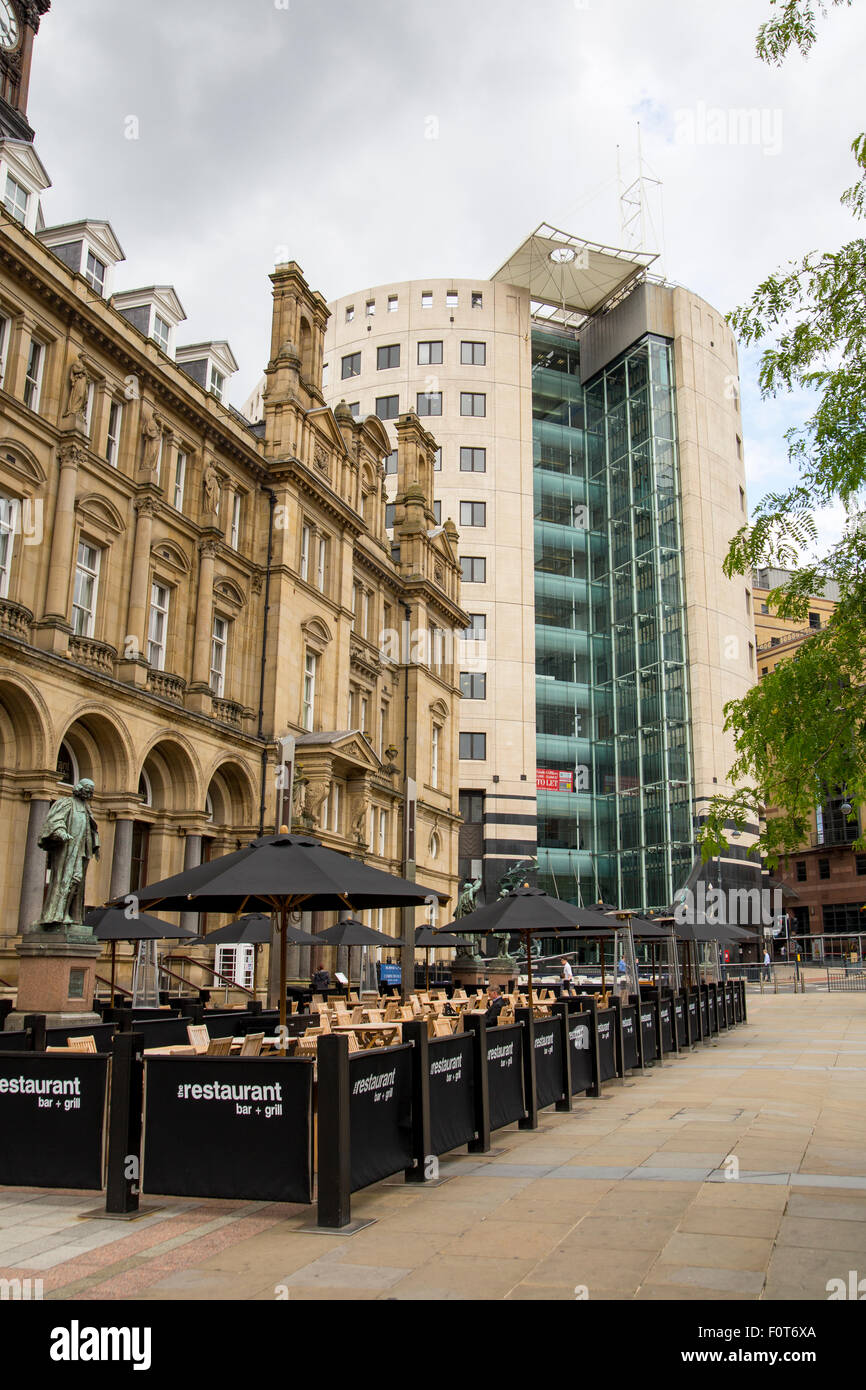 A view across City Square in Leeds.  Photograph showing outside dining and one city square offices Stock Photo