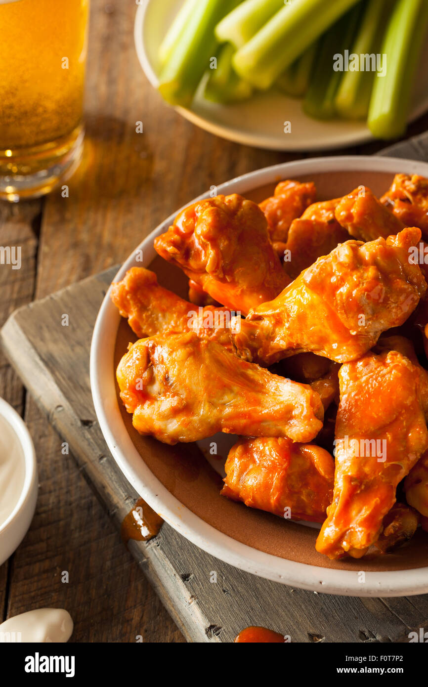 Spicy Homemade Buffalo Wings with Dip and Beer Stock Photo