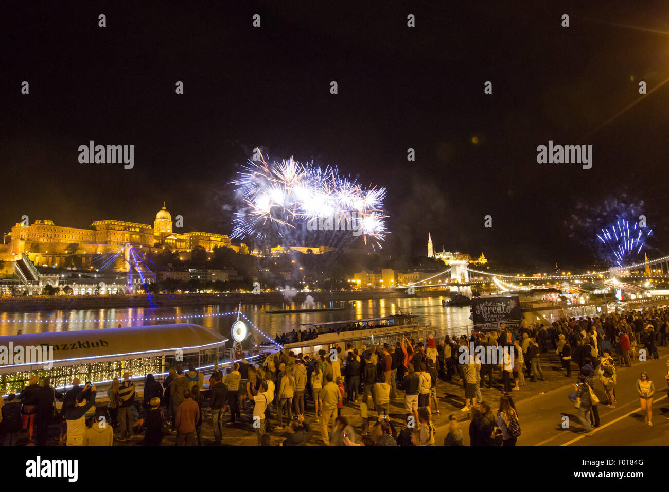 Budapest, Hungary. 20th Aug, 2015. Fireworks are seen over the Danube to celebrate Hungarian national holiday in Budapest, Hungary, on Aug. 20, 2015. Hungarians turned out en masse despite sudden chilly weather to mark their national holiday on Thursday, Aug. 20, the day commemorating Saint Stephen, the founding king of Hungary. Credit:  Csaba Domotor/Xinhua/Alamy Live News Stock Photo