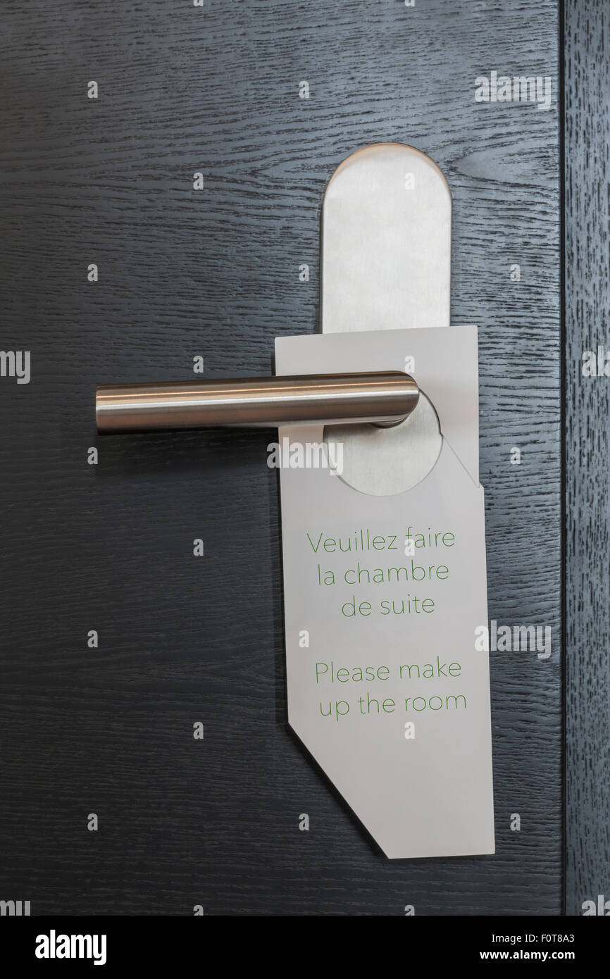 Hotel Door sign 'Please make up the room' in french and english Stock Photo