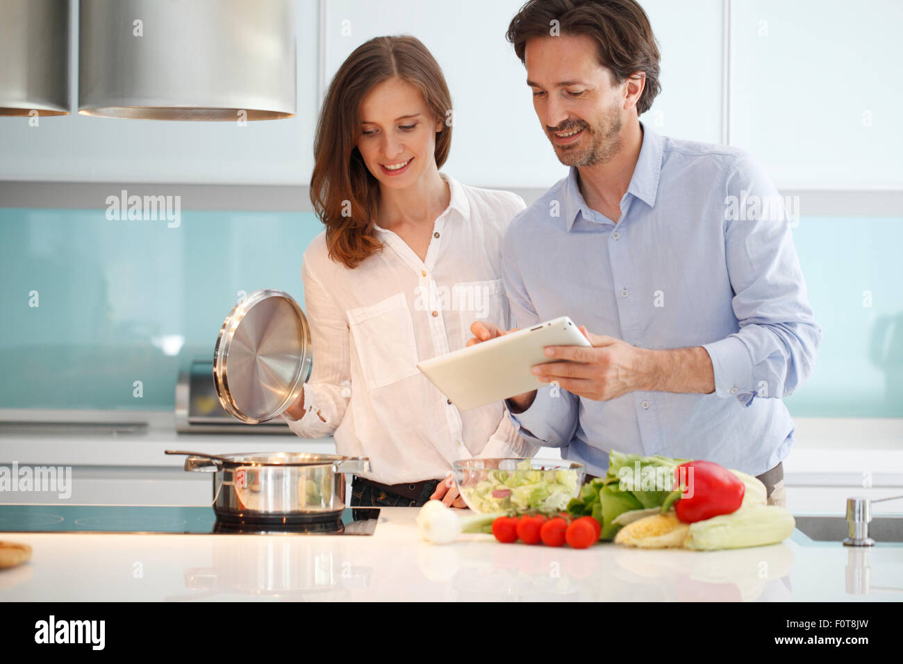 couple cooking dinner Stock Photo