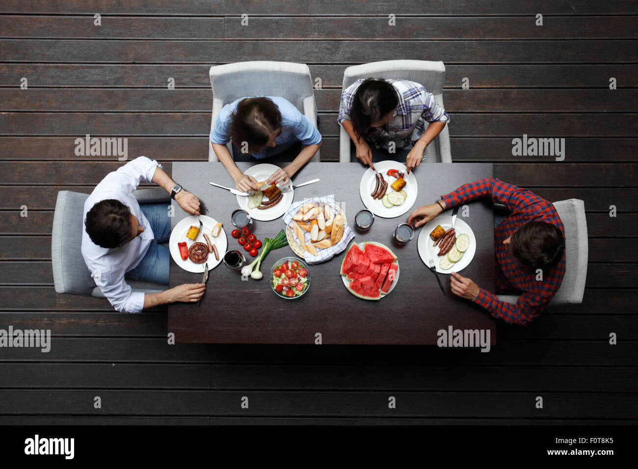 two couples eating dinner Stock Photo Alamy two couples eating dinner Stock Photo Alamy