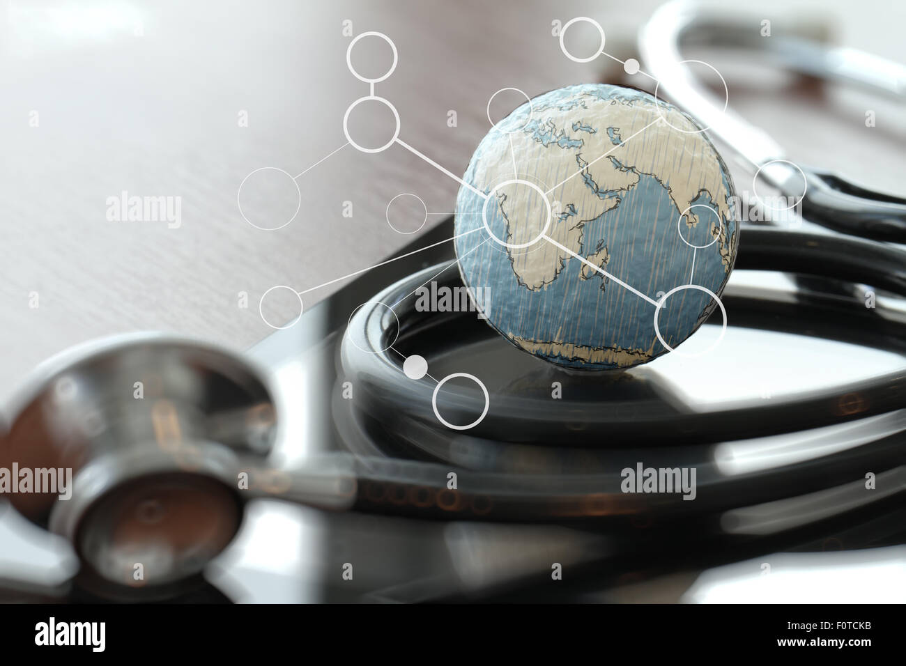 stethoscope and texture globe with digital tablet as medical network concept Stock Photo