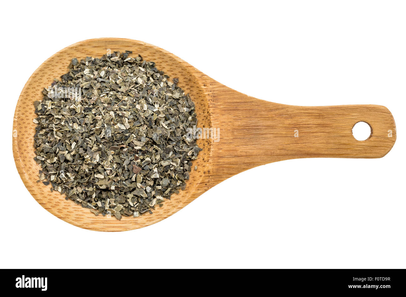 dried wakame seaweed - top view of a wooden spoon isolated on white Stock Photo
