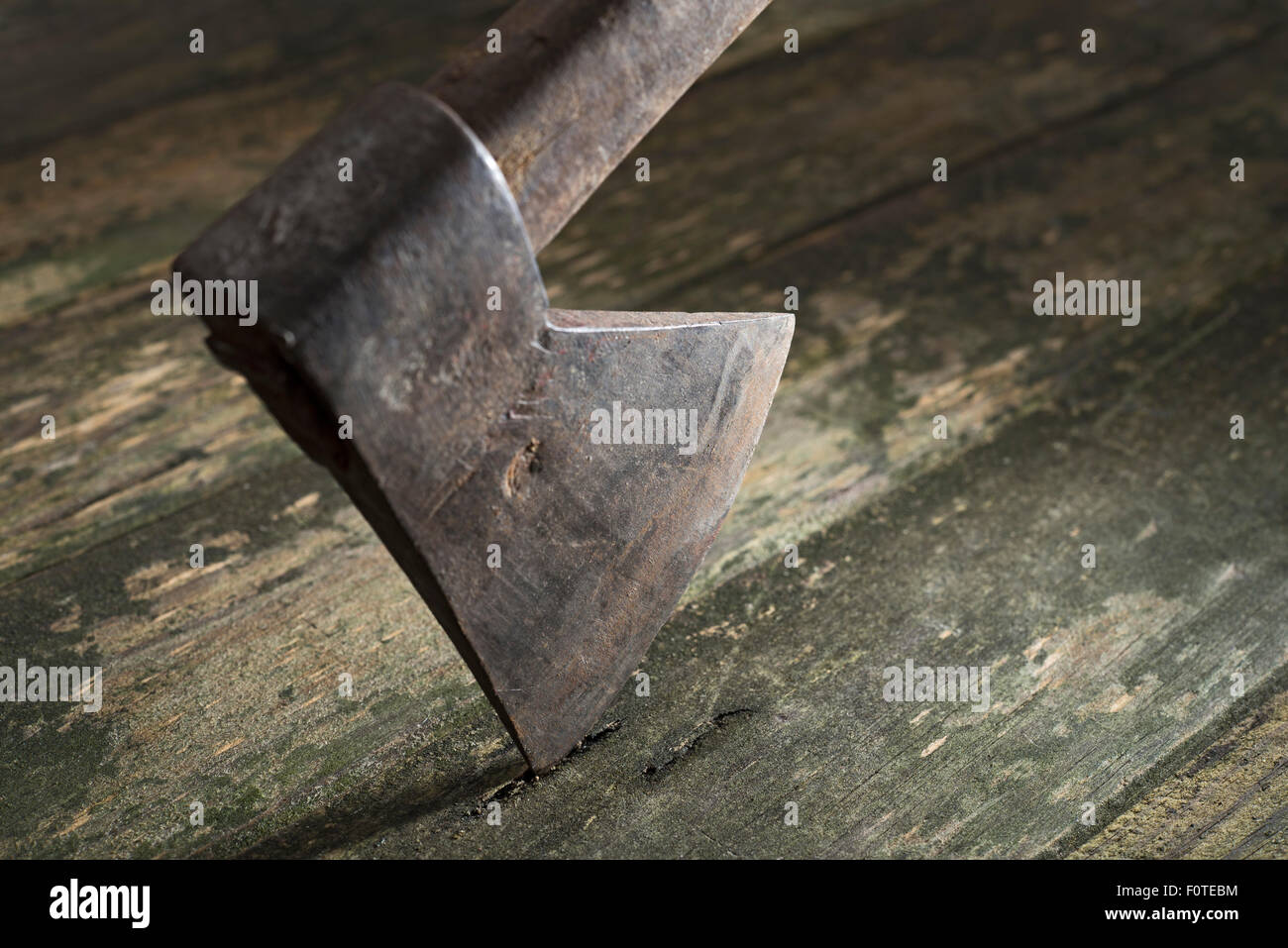 old ax on wood background Stock Photo