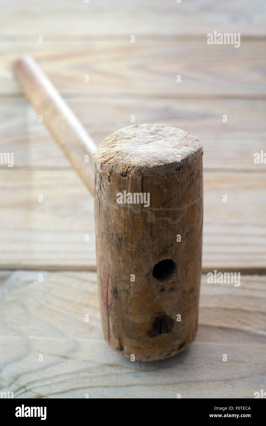 Hammer made of wood, carpentry tool. Stock Photo