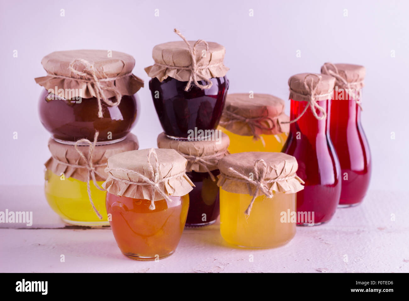 Preserved homemade fruits and berries jam in the jar. Rustic style