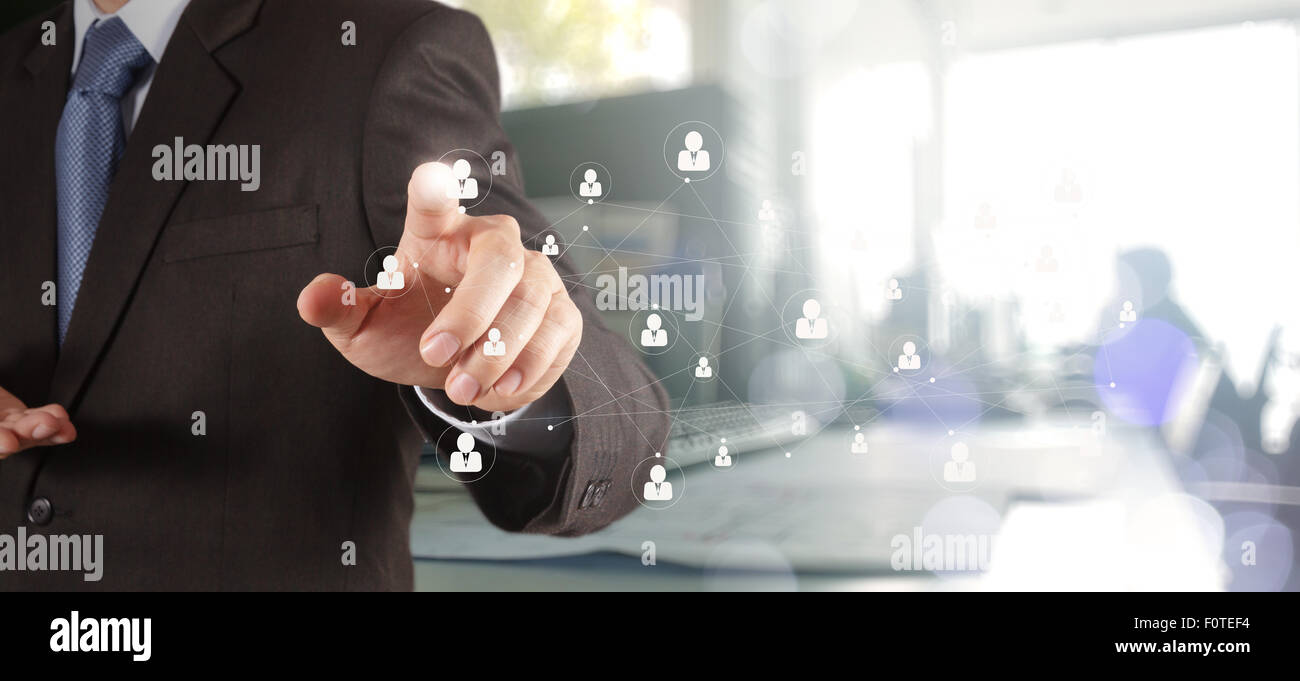 Double exposure of businessman working with new modern computer show social network structure as concept Stock Photo