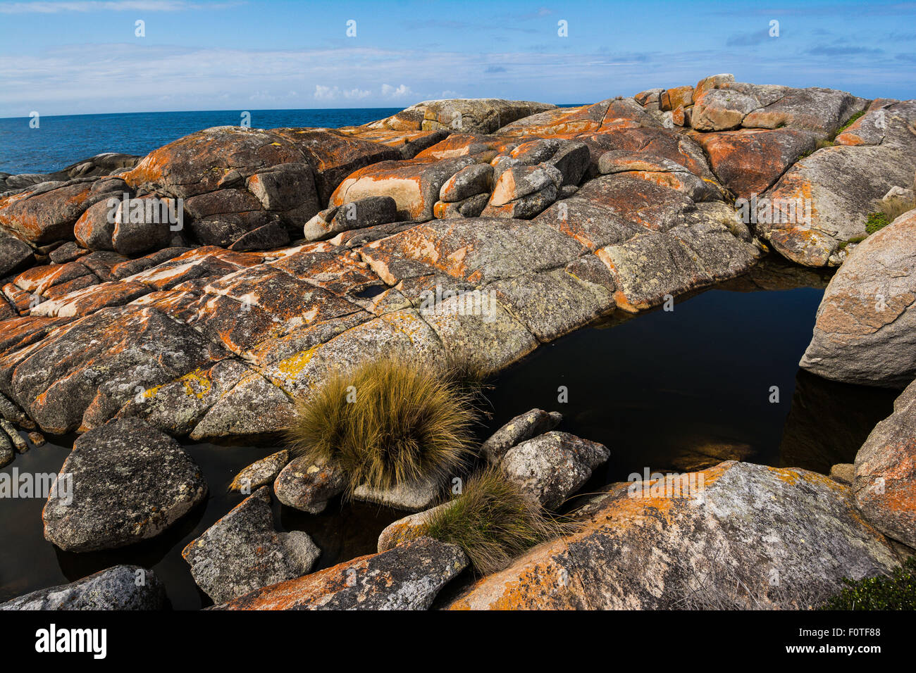 The colorful granite boulders at Binalong Bay, Bay of Fires, St. Helens, Tasmania Stock Photo