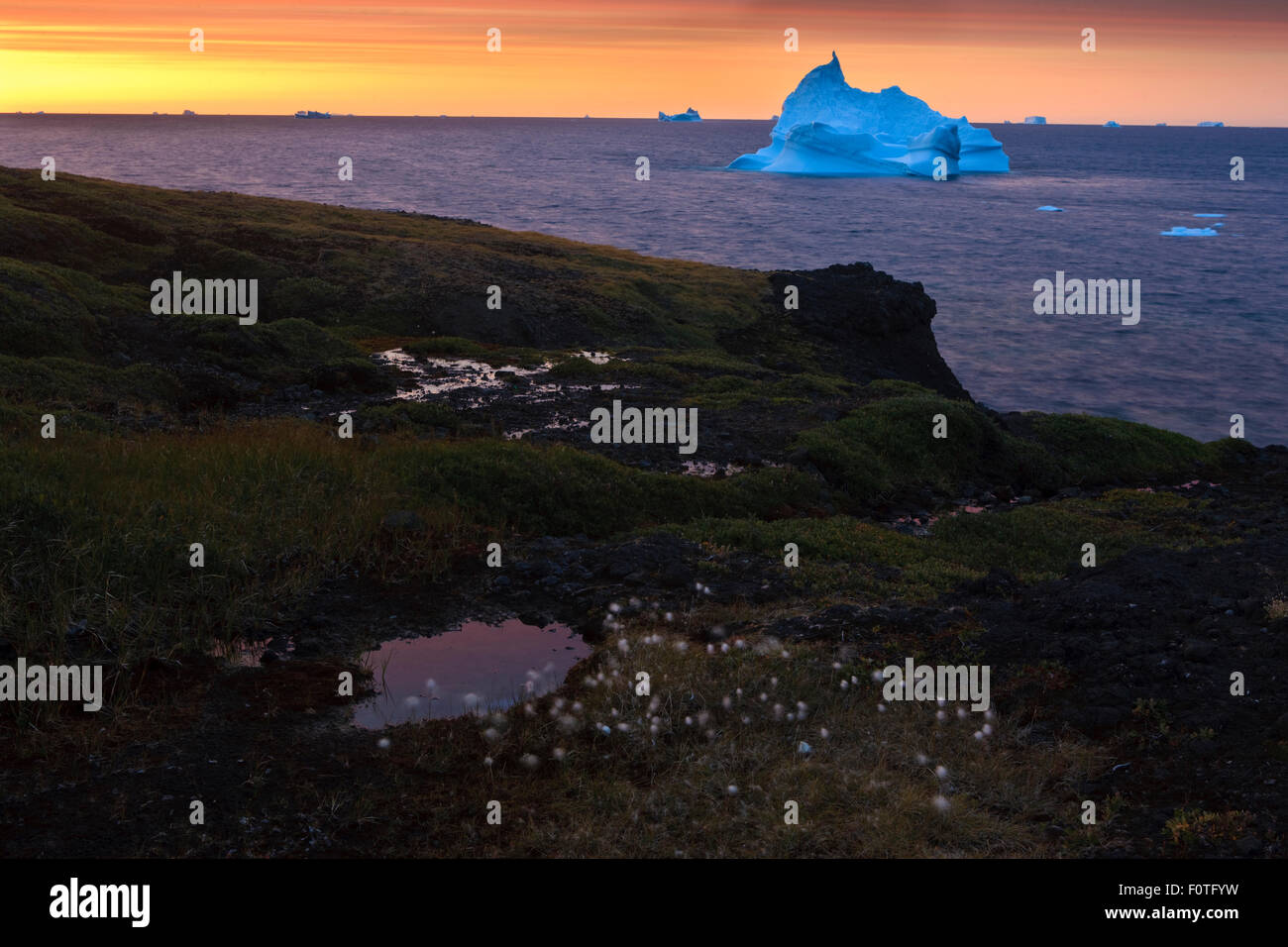 Iceberg off the coast of Disco bay at sunrise, Qeqertarsuaq Greenland, August 2009. Exclusive Japanese calendar rights for 2014. Stock Photo