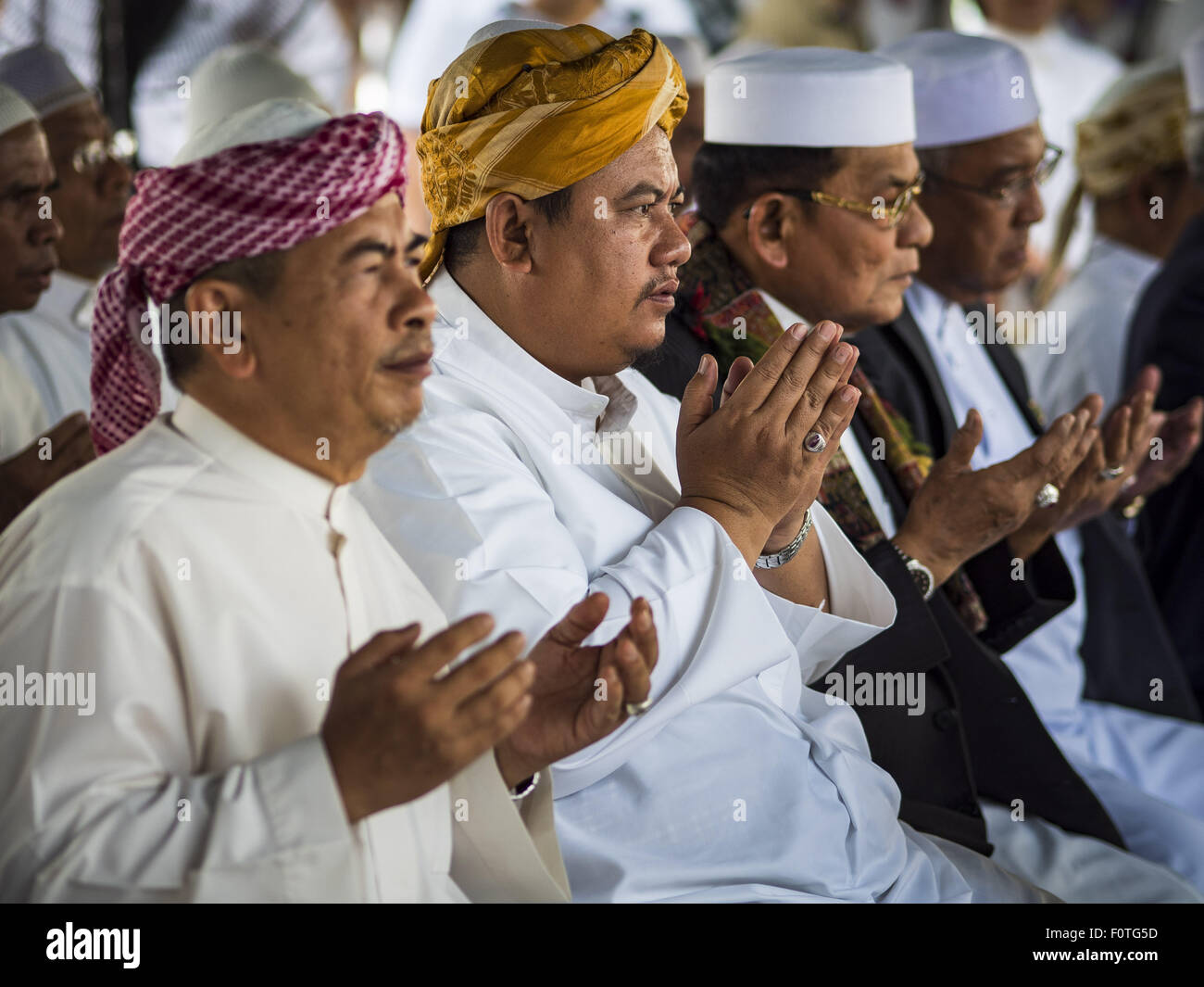 Bangkok, Thailand. 21st Aug, 2015. Muslim Imams participate in the Muslim prayer service at Central World to honor the dead from the Erawan Shrine bombing. The Bangkok Metropolitan Administration (BMA) held a religious ceremony Friday for the Ratchaprasong bomb victims. The ceremony started with a Brahmin blessing at Erawan Shrine, which was the target of a bombing Monday night. After the blessing people went across the street to the plaza in front of Central World mall for an interfaith religious service. Credit:  ZUMA Press, Inc./Alamy Live News Stock Photo