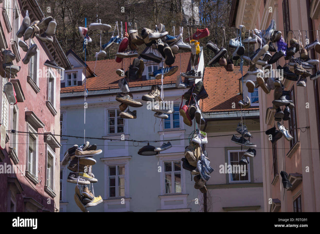 shoes hanging on wire in the center of Ljubljana Stock Photo - Alamy