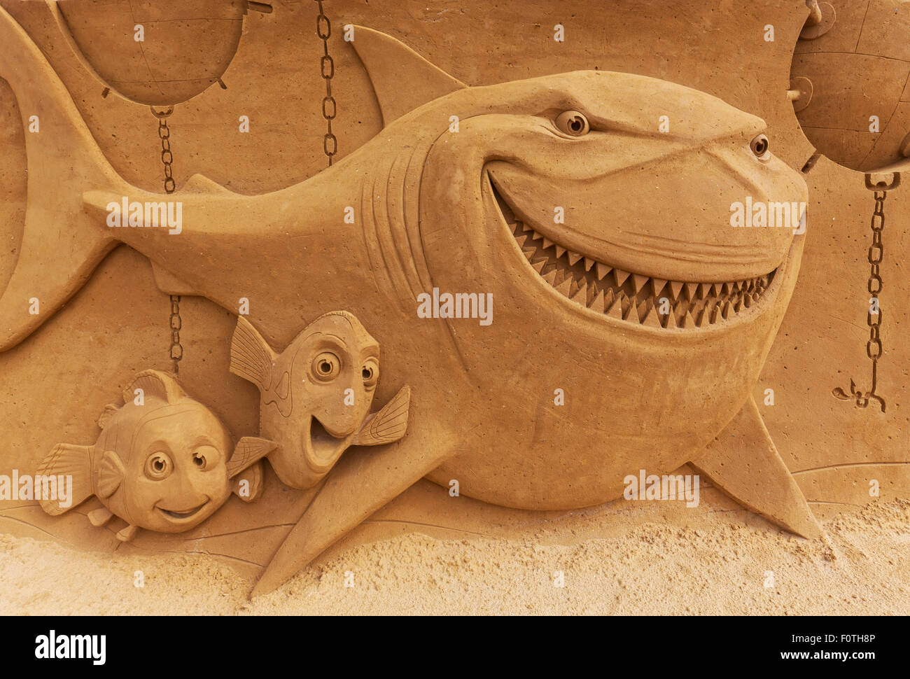 Shark and little fish, sand sculptures, from Finding Nemo, Sand Sculpture Festival Frozen Summer Sun, Oostende, West Flanders Stock Photo