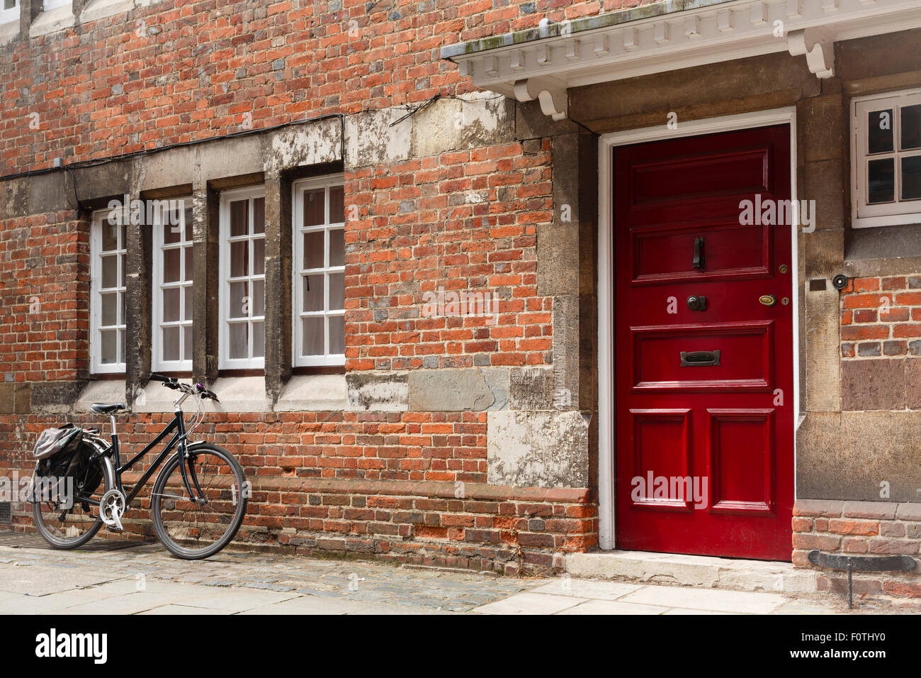 Retro bicycle leaning against the wall of an old historic building Stock Photo
