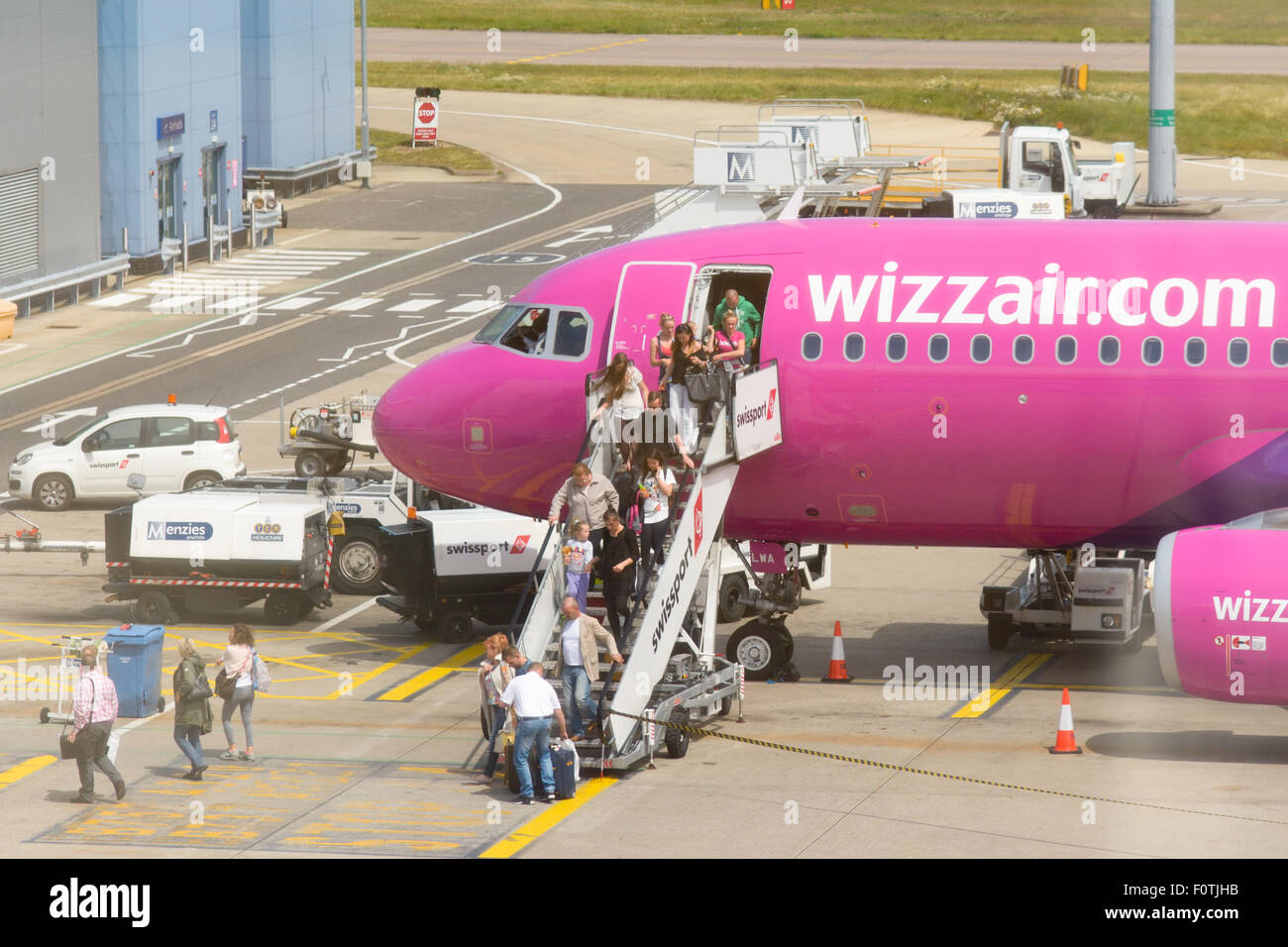 Passengers disembarking Wizzair.com flight at Luton Airport, Luton, Bedfordshire, England Stock Photo