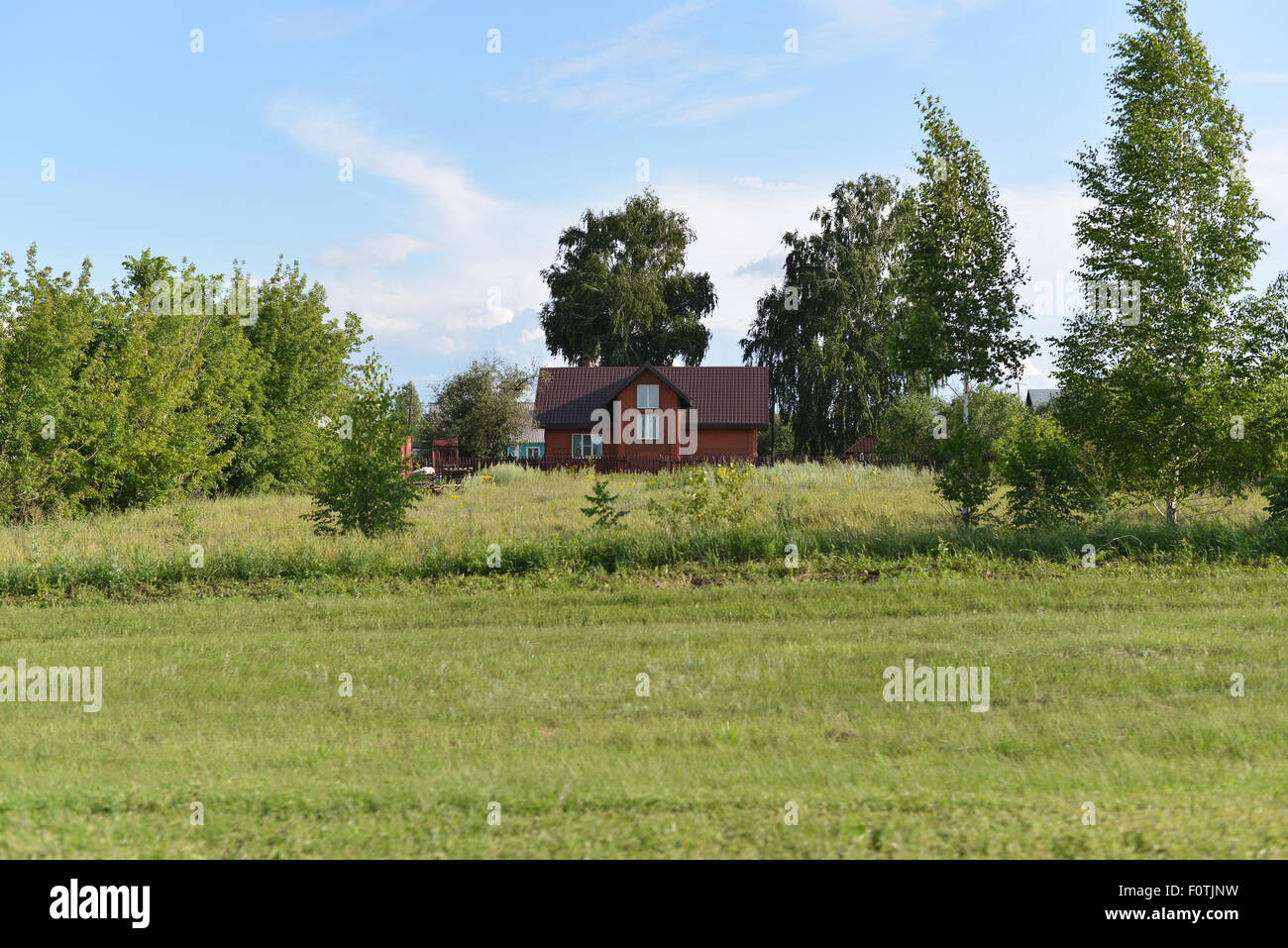 rural landscape with a house and a trees Stock Photo - Alamy