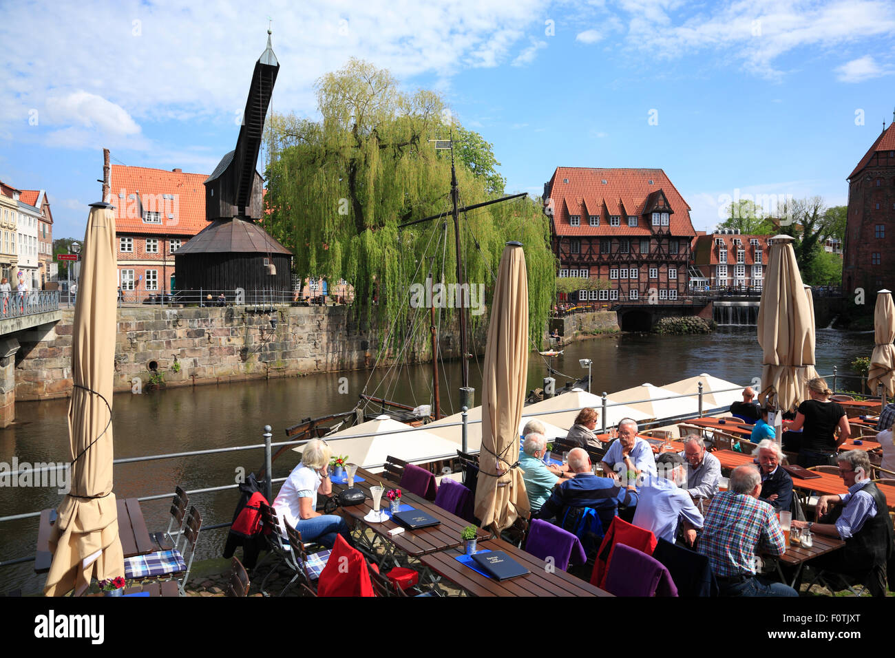 Cafes at Stintmarkt, old harbour quarter at river Ilmenau,  Lüneburg,  Lueneburg, Lower Saxony, Germany, Europe Stock Photo