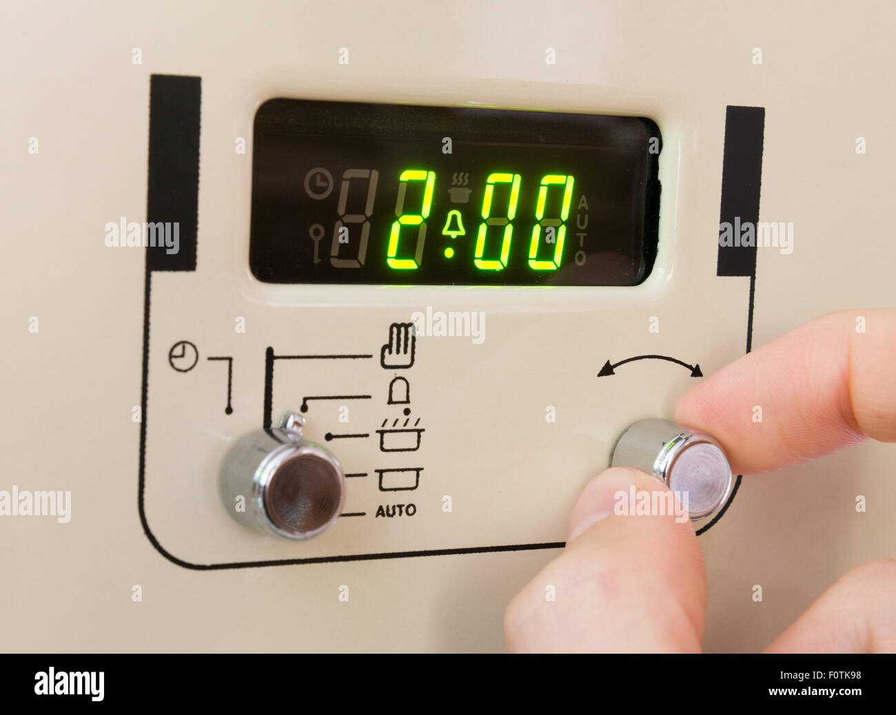 Setting a cooker timer to 2 hours Stock Photo Alamy