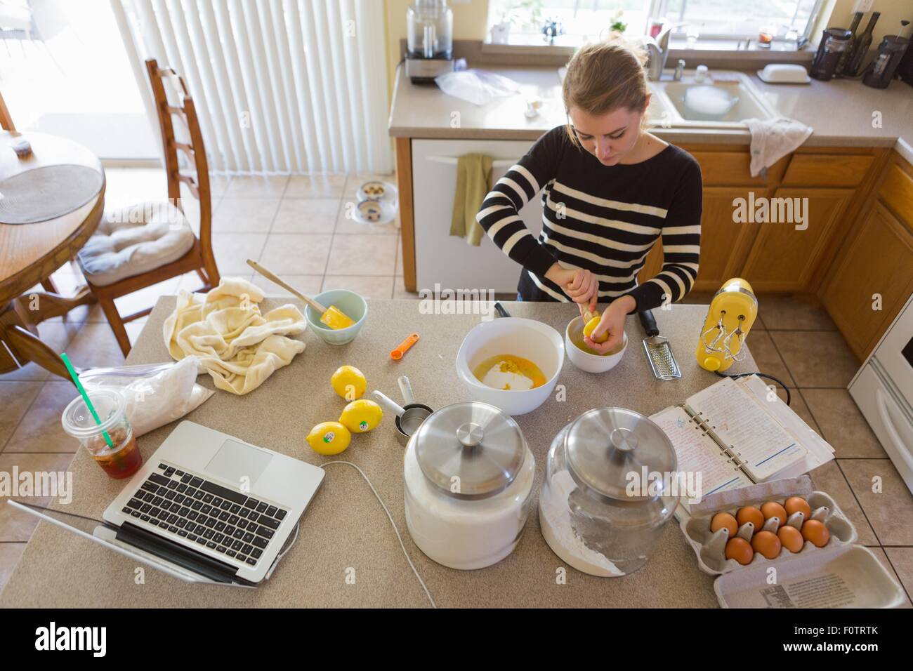 Woman baking in kitchen Stock Photo Alamy