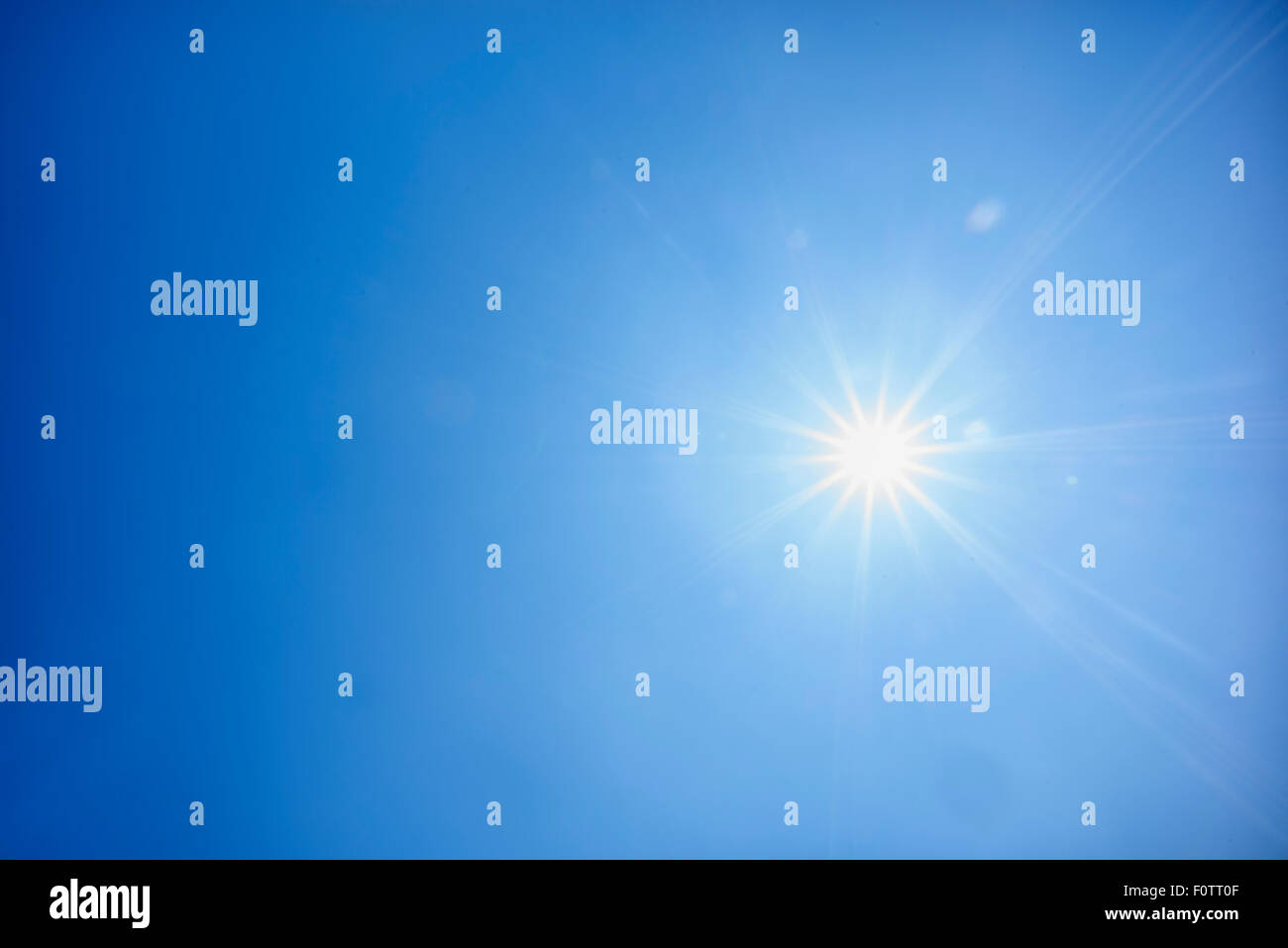 the bright sun in the blue sky Stock Photo