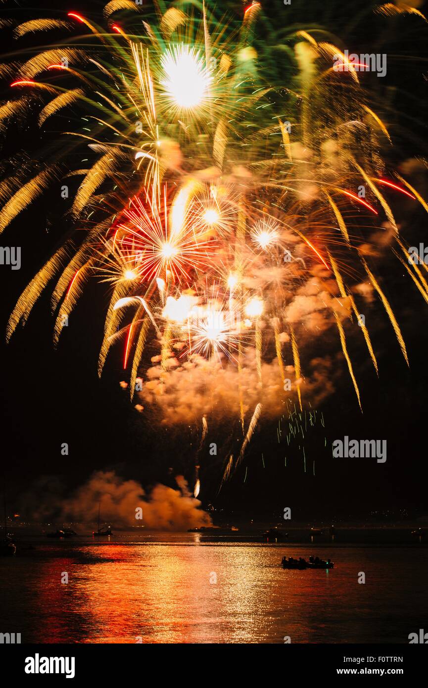 Fireworks exploding over water, Bainbridge Island, Washington, USA
