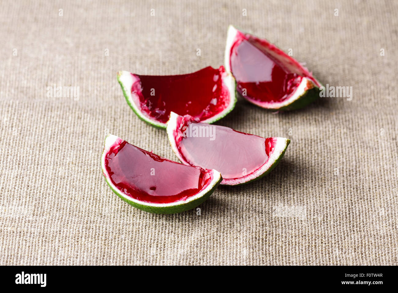 Watermelon like tequila jelly (jello) shots made out of carved lime on