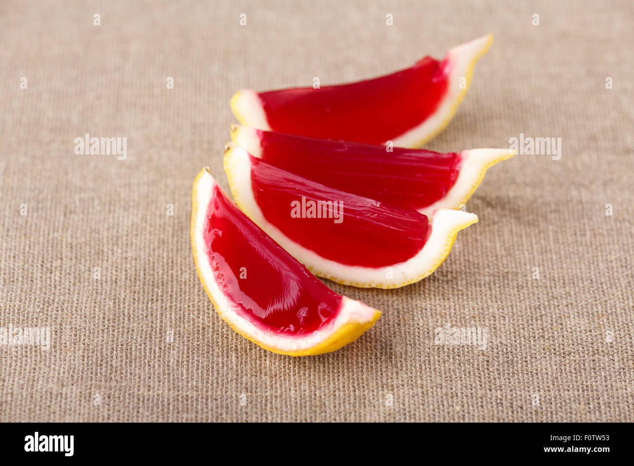 Lemon tequila strawberry jelly (jello) shots on a linen clothed table